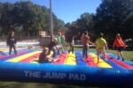 Children Jumping on Inflatable Jump Pad